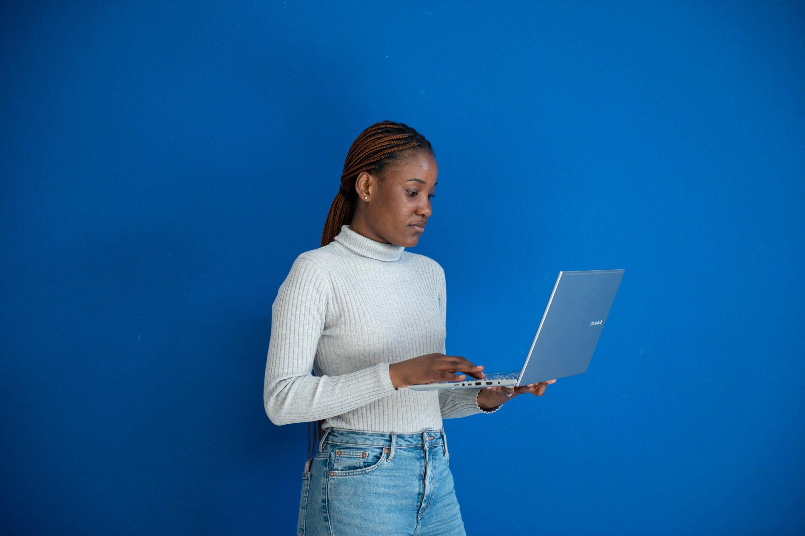 Refugee student looking at a laptop screen
